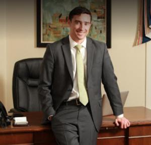 The fourth James Hardy Price, James the Fourth stands in from of his desk at the law firm's downtown Greenville SC law office. Whether you need divorce lawyers in Anderson SC, or Spartanburg divorce attorneys, James can be there for your aggressive representation.